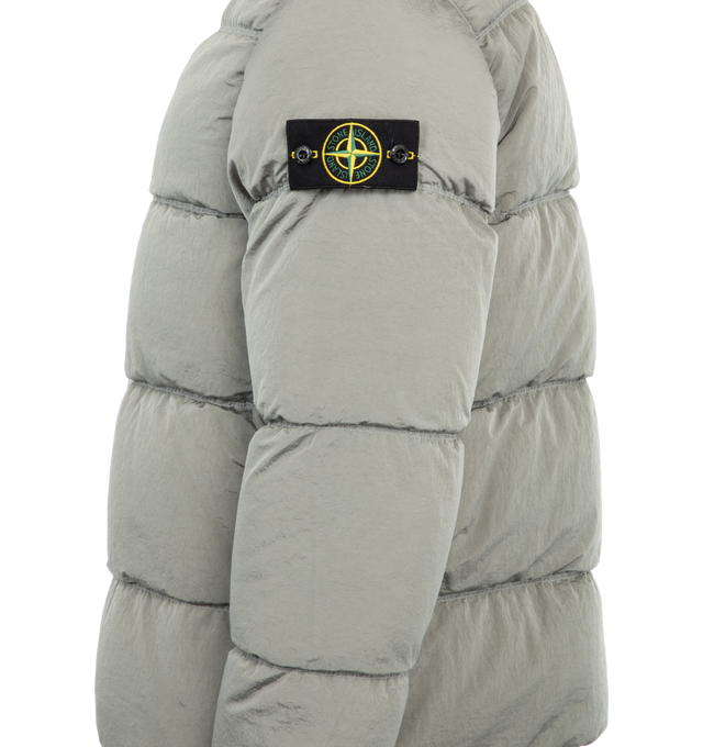 Image 3 of 3 - GREY - Stone Island Giubbotto Vera Piuma RDS Jacket has a classic hood, 2-way zipper closure, collar, zipper side pockets, and detachable signature Compass badge. Down filled. 84% polyamide, 16% elastane.  