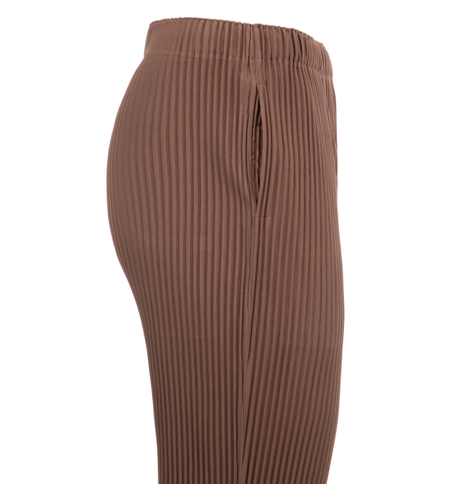 Image 3 of 3 - BROWN - Issey Miyake MC November Pants are a cropped style with an elastic waistband, side pockets, and a button fly closure. 100% polyester. Made in Japan.  