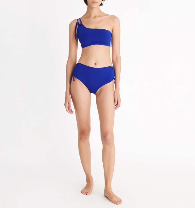 BLUE - ERES Ever High-Waisted Bikini Briefs featuring high-waisted bikini briefs, adjustable spaghetti link on each side with branded tips and side shirring. 84% Polyamid, 16% Spandex. Made in Morocco. 