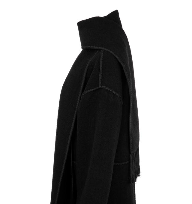 Image 3 of 3 - BLACK - TOTEME oversized coat with an embroidered attached scarf that wraps elegantly around the neck. Crafted from a heavyweight wool blend with artisanal blanket stitching and lustrous tassels, then complete with spacious pockets, high side slits and a buttoned front. 68% wool, 20% wool recycled, 12% polyester recycled. 