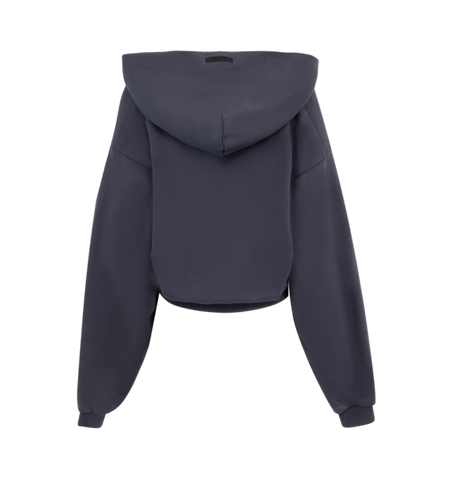 Image 2 of 2 - NAVY - Fear of God Essentials Womens  V-neck cropped, boxy hoodie crafted from heavy cotton fleece featuring an old-English logo university crest graphic at the front, ribbed trims and raw cut v-neck and signature rubberized patch on the hood. 100% Cotton. 