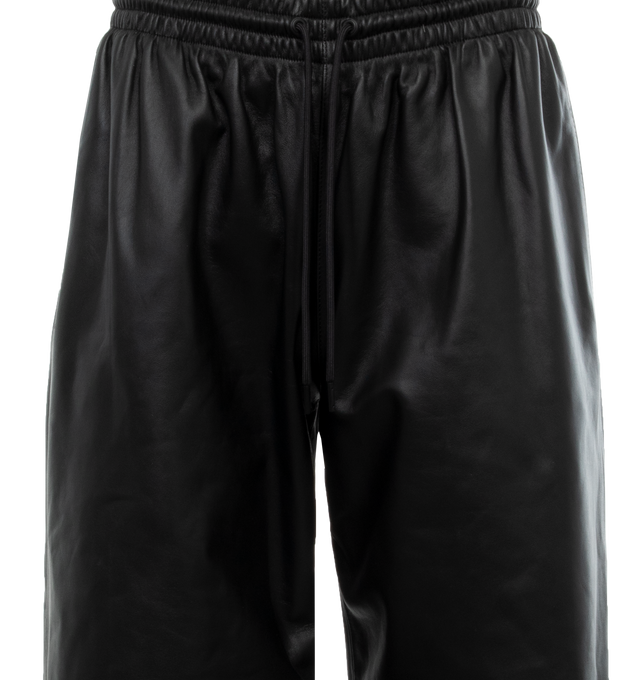 Image 4 of 4 - BLACK - WARDROBE.NYC Leather Track Pant featuring a relaxed fit, elasticated waist with drawcords and zipped pockets. 100% leather. Lining: 100% cotton. Made in France. 