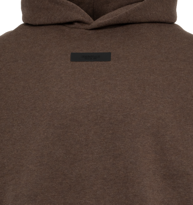 Image 4 of 4 - BROWN - FEAR OF GOD ESSENTIALS Hoodie featuring elastic waist and cuffs, fixed hood, side pockets and rubber logo on chest. 100% cotton.  