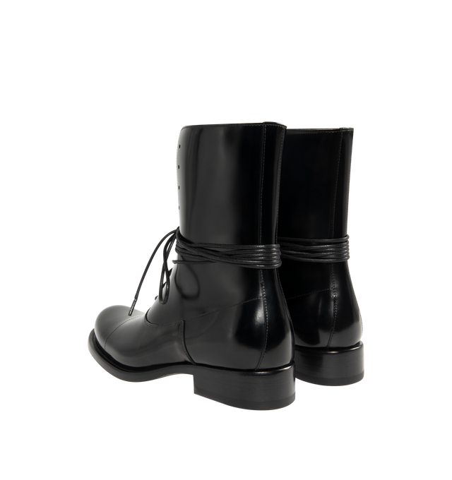 Image 3 of 4 - BLACK - THE ROW Kai Lace Up Boot featuring lace-up ankle boot in glossy calfskin leather with elongated round toe, extended leather sole and stacked leather heel. 100% calfskin leather. Leather sole. Made in Italy. 
