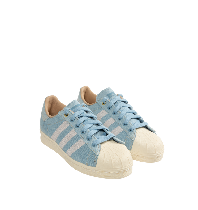 Image 2 of 5 - BLUE - Adidas Superstar Sneakers 82 (Mens) are a lace-up, low-top style with a shell toe and heel tab, canvas uppers with suede details, and premium rubber outsoles. Unisex style in men's sizing. Made in Indonesia.  