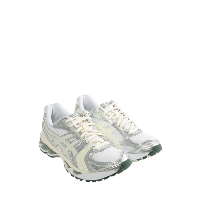 Image 2 of 5 - WHITE - Asics GEL-Kayano 14 Sneakers are lace-up style with rip-stop underlays, GEL cushioning, and TRUSSTIC support system. Unisex style in men's sizing. Imported from Indonesia. 