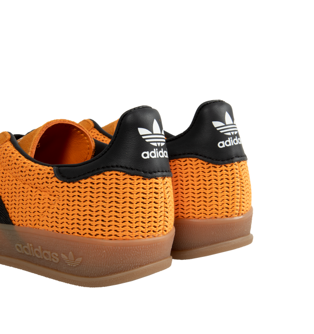 Image 3 of 5 - ORANGE - ADIDAS Gazelle lace-up soccer-inspired adidas shoes made with premium materials. Crafted with a breathable cotton mesh upper with suede overlays, classic T-toe, 3-Stripes and gum rubber outsole. Unisex style in mens sizing. 