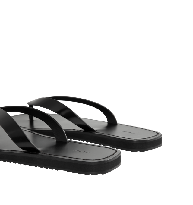 Image 3 of 4 - BLACK - THE ROW City Flip Flop featuring refined flip flop sandal in glossy calfskin leather with contrast leather footbed, stitched detailing, and lightly treaded rubber sole. 100% calfskin leather. Made in Italy. 