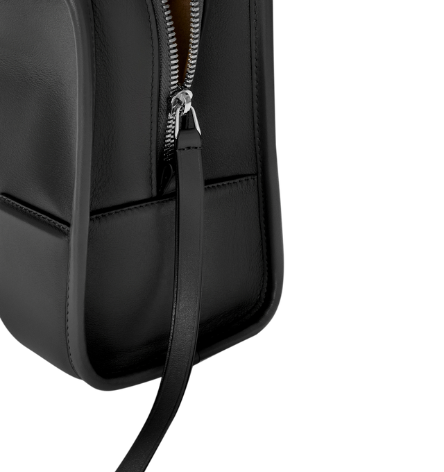 Image 14 of 17 - BLACK - Loewe Amazona Medium 180 Bag in soft calfskin leather featuring a relaxed silhouette with a single toron top handle, designed to be carried open, while a concealed closure secures the main compartment, removable shoulder and crossbody straps, zip closure with two leather zip pullers, two compartments, main compartment closed with magnetic closure, internal flat pocket, suede lining and embossed logo. Soft calfskin. Strap length 108 cm; Strap Drop 50 cm; Handle drop 11 - 28 cm; Heigh 