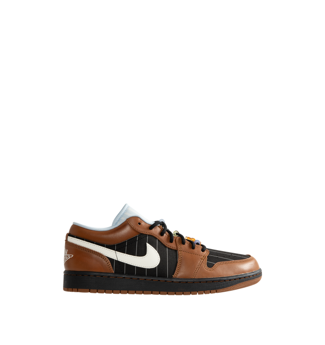 Image 1 of 5 - BROWN - Men's Air Jordan 1 Low SE Sneakers feature a genuine leather and suede upper with the iconic low-top silhouette, signature Wings branding, and a Jumpman logo for a premium take on a timeless classic. These lifestyle sneakers combine encapsulated Air-Sole cushioning with a durable rubber outsole for lightweight comfort, lasting support, and reliable everyday traction. Main Material: Genuine Leather and Suede. Midsole: Encapsulated Air-Sole Unit. Sole: Rubber. 
