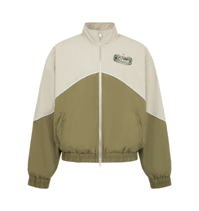 Image 1 of 3 - GREEN - Rhude Desert Racing Track Jacket is crafted from nylon and features a sport-inspired silhouette designed with racing influences. Detailed with graphic branding, a full-zip front, and functional pockets, the jacket combines technical construction with elevated everyday wear. Main Material: 100% Nylon. Lining: 100% Polyester. Made in USA. 