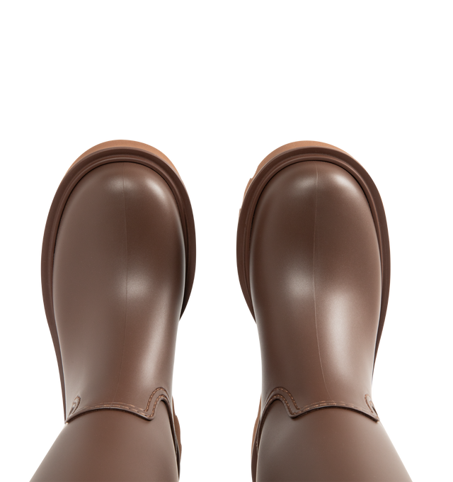 Image 4 of 4 - BROWN - MONCLER Kickstream High Rain Boots featuring PVC and nylon upper, fabric insole, TPU welt, EVA tread, drawstring fastening and waterproof. Calf height 35 cm. Sole height 4 cm. 100% polyvinyl chloride. Lining: 80% polyamide/nylon, 20% elastane/spandex. Sole: 100% elastodiene. Made in Italy. 