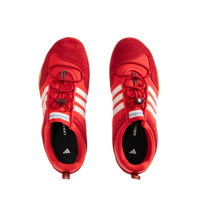 Image 5 of 5 - RED - Adidas Mens Originals x Bad Bunny Ballerina Sneakers are crafted from canvas and suede. Features a low-cut silhouette, lace-up closure with bungee-cord laces, signature 3-Stripes, "Benito" branding, adidas para Bad Bunny detailing, heel pull tab, textile lining, and gum rubber outsole. Upper: Canvas and Suede; Lining: Textile; Outsole: Rubber. Made in Vietnam. 