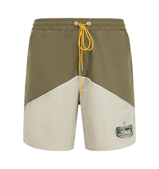 Image 1 of 3 - GREEN - Rhude Desert Racing Track Short is crafted from lightweight nylon and features a relaxed athletic silhouette designed for comfort and movement. Detailed with Desert Racing-inspired graphics, an elasticated waistband, and functional pocket styling, the shorts offer a sport-driven look for everyday wear. Main Material: 100% Nylon. Made in the USA. 
