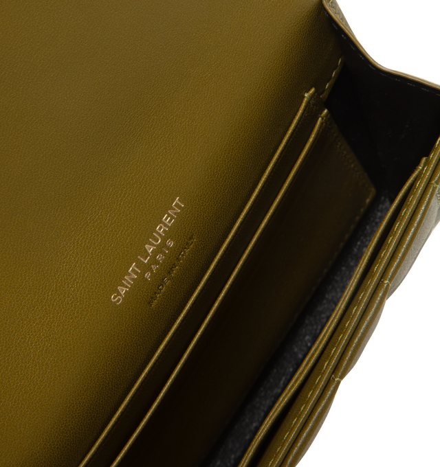Image 3 of 3 - GREEN - SAINT LAURENT Envelope Small Wallet featuring quilted overstitching, leather lining, snap button closure, external back pocket, four card slots and one main compartment. 5.1 X 3.7 X 0.7 inches. 70% lambskin, 30% metal.  
