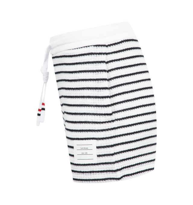 Image 3 of 3 - NAVY - Thom Browne Summer shorts crafted from breathable textured cotton fabric featuring drawstring waistband, name tag applique and signature striped grosgrain loop tab. 100% Cotton. Made in Italy. 