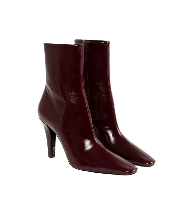 Image 2 of 4 - RED - SAINT LAURENT Jill Booties featuring ankle boots with a square pointed toe and tapered block heel with inner cassandre, a side zip closure and leather sole. 3.7 inch heel. Calfskin. Made in Italy. 