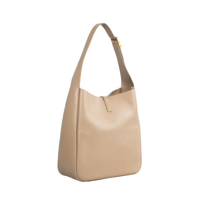 Image 2 of 3 - NEUTRAL - SAINT LAURENT Large Le 5  7 Supple featuring two main compartments, inner zip pocket, adjustable strap, open top with cassandre hook closure and suede lining. 11.8 X 12.2 X 5.1 inches. Handle drop: 11.8 inches. 100% calfskin leather. Made in Italy.  