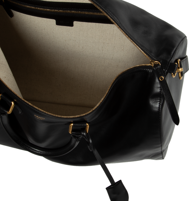 Image 3 of 3 - BLACK - KHAITE Pierre Weekender Bag featuring refined duffel with twinned top handles and gold hardware. Internal zip pocket. Includes lock, key, clochette, and adjustable shoulder strap. 18.11 in x 7.87 in x 10.63 in. 100% calfskin. 