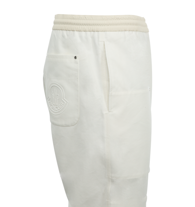 Image 3 of 3 - WHITE - Moncler Embroidered Logo Jogging Pants have an elastic drawstring waist, a zipper closure, side pockets, adjustable cuffs, and a rear patch pocket. Cotton and nylon canvas.  