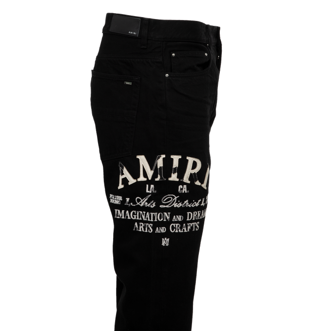 Image 2 of 3 - BLACK - AMIRI Distressed Arts District Jeans featuring belt loops, five-pocket styling, button-fly, logo embroidered at outseam, leather logo patch at back waistband, logo plaque at back pocket and logo-engraved silver-tone hardware. 100% cotton. Made in United States. 