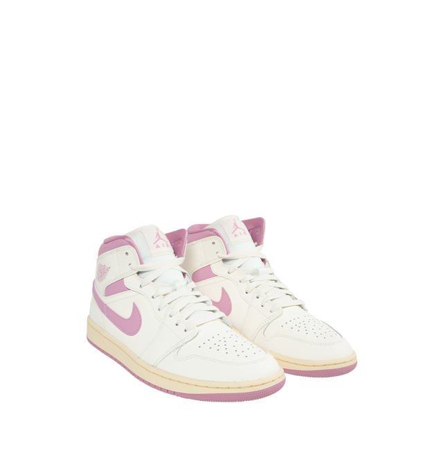 Image 2 of 5 -  PINK - JORDAN Air Jordan 1 Mid-top lace-up sneakers featuring premium leather and synthetic upper provides durability, comfort and support. Air-Sole unit in the heel delivers signature cushioning. Rubber outsole offers traction on a variety of surfaces. 