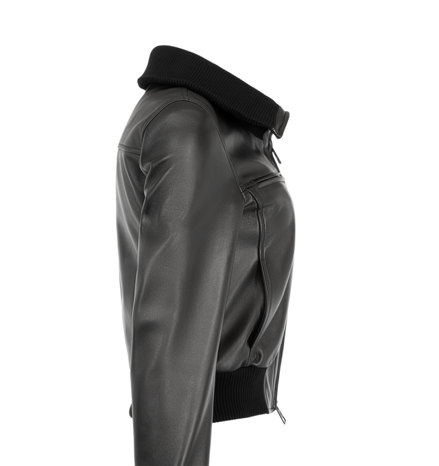 Image 3 of 3 - BLACK - Balenciaga Women's High-Collar Fitted Jacket is crafted from supple calf leather and features a sleek fitted silhouette with a signature high collar. Designed with rib-knit trim throughout, this streamlined jacket is detailed with zip-fastening chest pockets, a front zip closure, rib-knit cuffs and hem, and a debossed Balenciaga logo at the chest. Main Material: 100% Calf Leather. Trims: 100% Fabric. Collar: High Rib-Knit Collar. Made in Italy. 