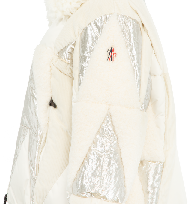 Image 3 of 3 - WHITE - MONCLER GRENOBLE Pamiers Patchwork Insulated Ski Jacket featuring teddy, polyester and metallic fabric intarsia, polyester lining, down-filled, wool blend collar, zipper closure, zipped pockets, inside media pocket with YKK AcquaGuard highly water resistant zipper closure, ski pass pocket with zipper closure, powder skirt, adjustable cuffs, hem with drawstring fastening and technical jersey wrist gaiters. 100% polyester. Collar: 90% virgin wool, 10% polyester. Padding: 90% down, 10% f 