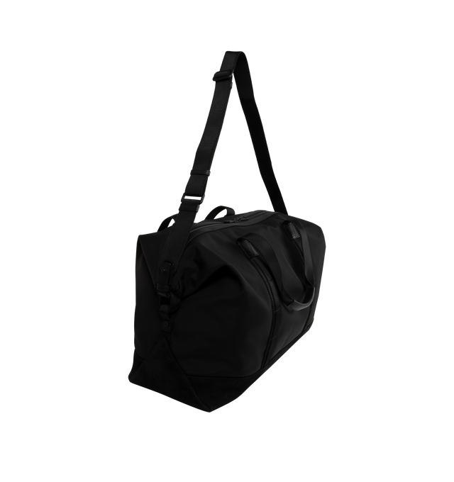 Image 2 of 3 - BLACK - Moncler Tech Duffle Weekend Bag has an adjustable and detachable shoulder strap, double handles, leather trim, a buckle closure, and a zipper pocket. Water-repellent nylon. Made in Romania.  