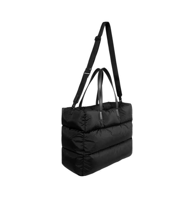 Image 2 of 3 - BLACK - MONCLER Caradoc Water-Repellent Tote Bag featuring nylon technique lining, calf leather trim, down-filled, leather handles, adjustable and detachable shoulder strap, snap button closure and inner zipped pocket. W 45 cm x H 35 cm x D 20 cm. 100% polyamide/nylon. Padding: 90% down, 10% feather. Made in Italy. 
