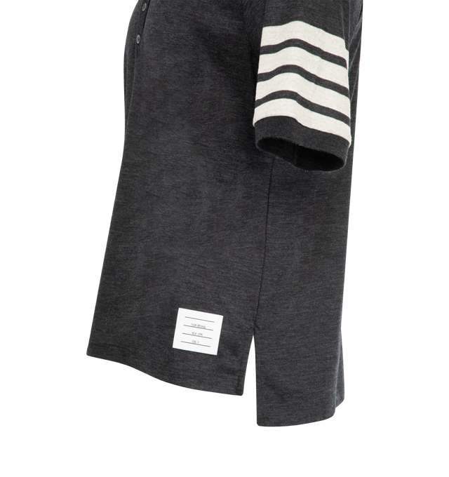 Image 3 of 3 - GREY - THOM BROWNE Wool Jersey 4-Bar Polo featuring partial front button closure, 4-bar detailing, name tag applique, buttoned side vents with signature striped grosgrain trim and signature striped grosgrain loop tab. 100% virgin wool. Made in Italy. 