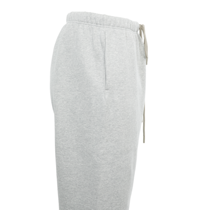 Image 3 of 4 - GREY - FEAR OF GOD ESSENTIALS Drawstring Sweatpants featuring drawstring at elasticized waistband, two-pocket styling, rubberized logo patch at front and elasticized cuffs. 80% cotton, 20% polyester. Made in Viet Nam. 