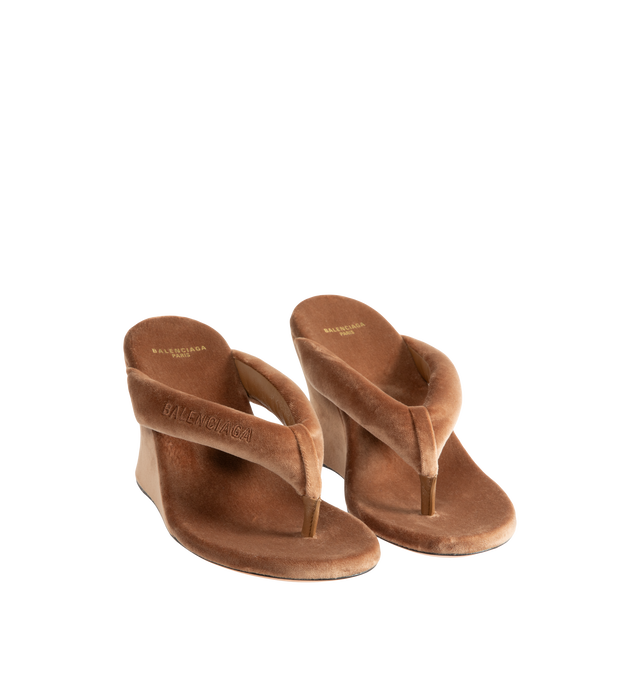 Image 2 of 4 - BROWN - Balenciaga Womens Gaeta Wedge Thong Sandals are crafted from a plush stretch velvet material. Feature a round toe, padded thong strap, slip-on design, 90mm arch wedge heel, and leather sole. Upper: cotton, viscose, elastane, Sole: calfskin, Insole: cotton, viscose, elastane. Made in Italy. 
