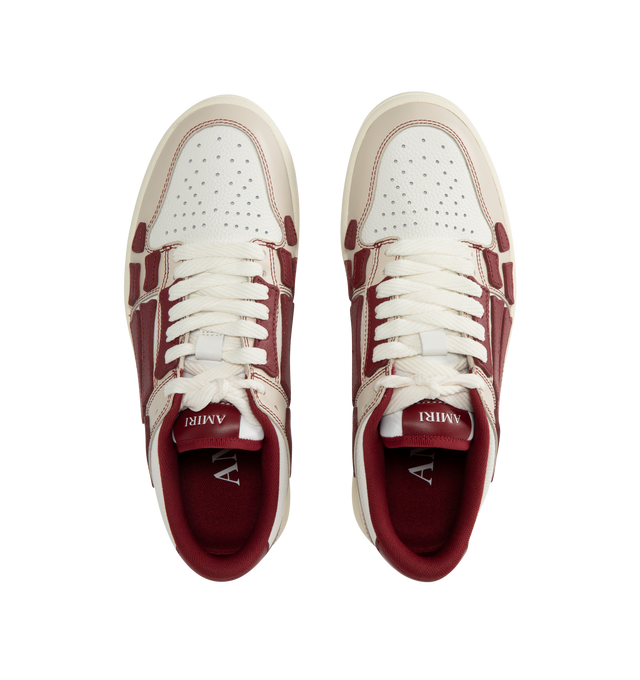 Image 5 of 5 - RED - Amiri Varsity Skel Top Low Sneakers are a lace-up style with perforation details, signature graphics, leather appliques, and two-tone rubber soles. Leather uppers. Made in Vietnam.  