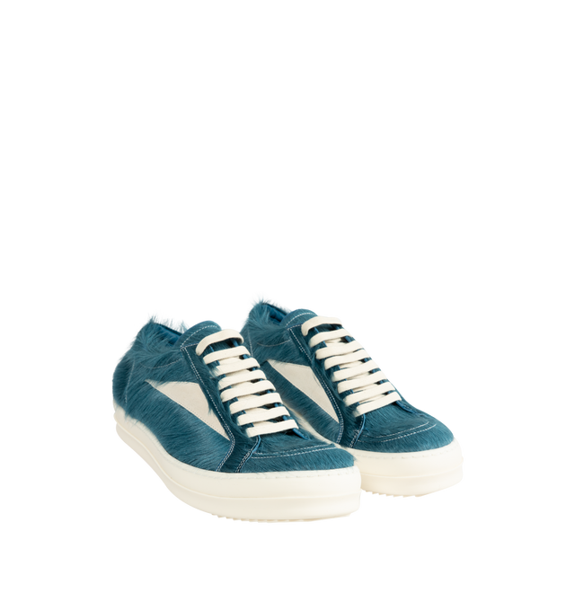Image 2 of 5 - BLUE - Rick Owens Men's Vintage Sneaks are crafted from hairy suede and full-grain calf leather and feature an under-ankle silhouette with contrast stitching, a padded ankle, and the brand's signature shark-toothed bumper sole. Designed with eight-eyelet lace-up fastening, a toe cap, and a resized triangular leather appliqu at the side for a distinctive vintage-inspired look. Main Material: 100% Calf Leather. Lateral Details: 100% Cow Leather. Lining: 100% Calf Leather. Insole: 100% Calf Leat 