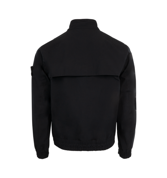 Image 2 of 3 - BLACK - Stone Island Bomber Jacket has a ribbed bomber collar, side pockets with flaps and snaps, a brand logo badge on the sleeve, ribbed cuffs and hem, and a 2 way zipper closure with a button placket. Padded with PrimaLoft-TC. External Fabric: 100% polyamide/nylon exterior. Made in Vietnam.  