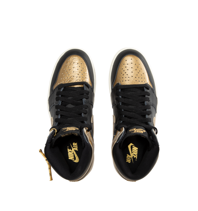 Image 5 of 5 - GOLD - Air Jordan 1 Retro High OG classic sneaker crafted from premium materials. Metallic gold leather upper offers durability and structure. Encapsulated Air-Sole units provide lightweight cushioning. Solid rubber outsoles give you traction on a variety of surfaces. Signature Wings logo stamped on collarStitched-down Swoosh logo. 