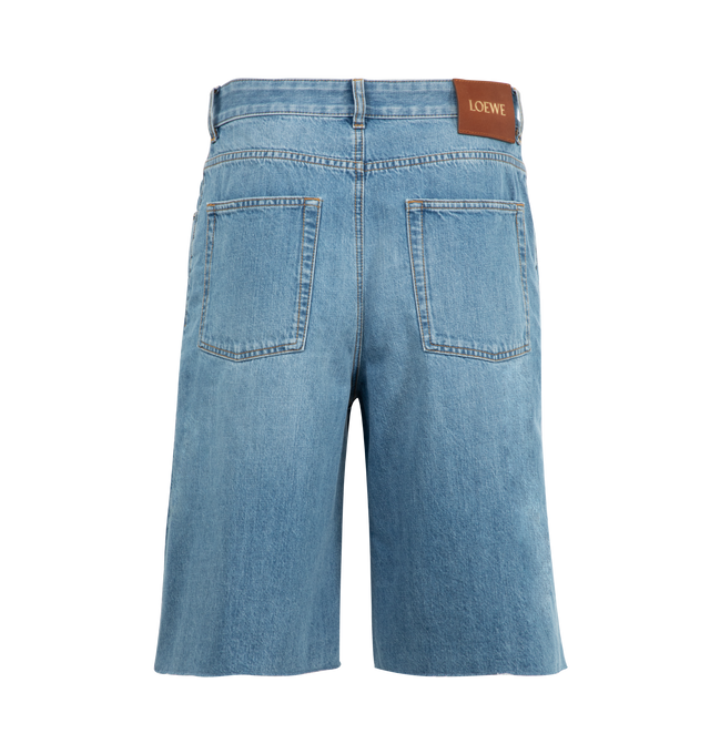 Image 2 of 3 - BLUE - LOEWE Anagram Shorts in denim featuring Anagram cut-outs at the knees, regular fit, regular length, mid waist, concealed button fly, five pocket style, raw hem and LOEWE embossed leather patch placed at the back. Cotton. Made in Italy. 