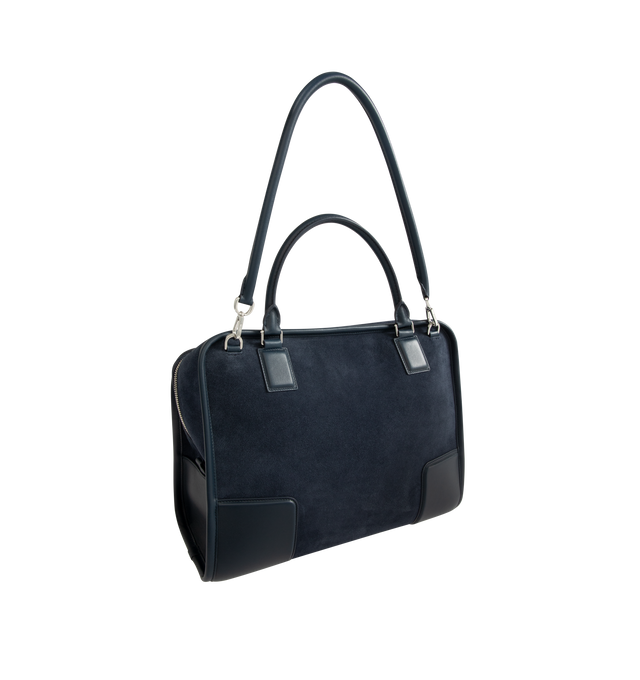 Image 3 of 5 - NAVY - LOEWE Large Amazona 180 Bag in suede featuring a relaxed silhouette anchored by a single toron top handle, designed to be carried open while a concealed closure secures the main compartment, removable shoulder and crossbody straps, zip closure with two leather zip pullers, two compartments, main compartment closed with magnetic closure, internal flat pocket, left side d-ring for customization, suede and nappa lambskin lining, embossed LOEWE and embossed double L branding. Suede/calf. 2 