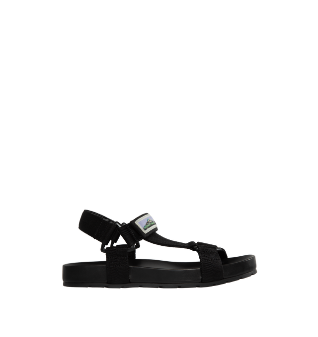 Image 1 of 4 - BLACK - BOTTEGA VENETA Trip Sandal featuring open toe, t-strap vamp, adjustable grip ankle strap and grip slingback strap. Rubber outsole. Made in Italy.