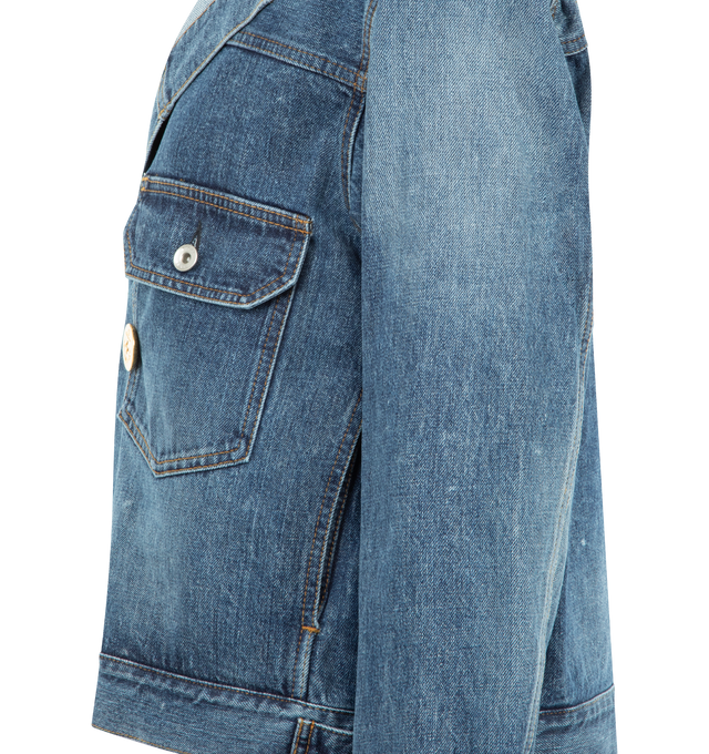 Image 3 of 3 - BLUE - SACAI Denim Jacket featuring a boxy silhouette, double-breasted front, gold-toned buttons, one button cuffs, buttoned pockets on chest, side slit pockets and adjustable tabs at the waist. 100% cotton. Made in Japan.     