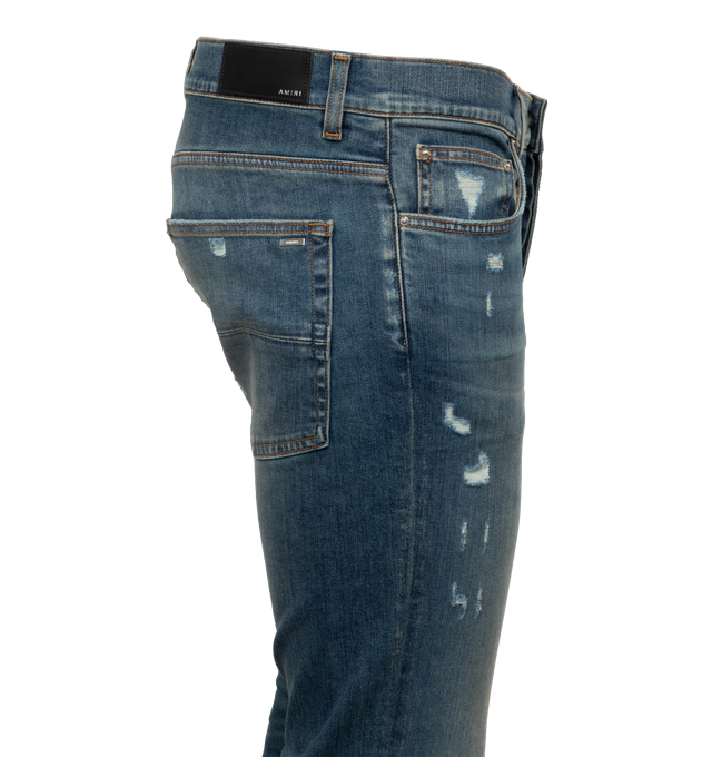 Image 2 of 3 - BLUE - AMIRI Mx1 Plaid Jean featuring button fly, 5-pocket design, intentionally destroyed areas and light whiskering and fading detail. 92% cotton, 6% elastomultiester, 2% elastane. Made in USA. 