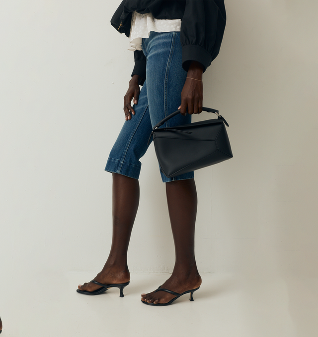 Image 2 of 4 - BLACK - LOEWE Medium Puzzle Edge Bag featuring distinctive geometric lines, cuboid form, shoulder, crossbody or hand carry, detachable and adjustable strap, zip closure with calfskin pull, one external zip rear pocket, two internal slip pockets, herringbone cotton canvas lining and embossed Anagram. Classic calf. Made in Spain. 