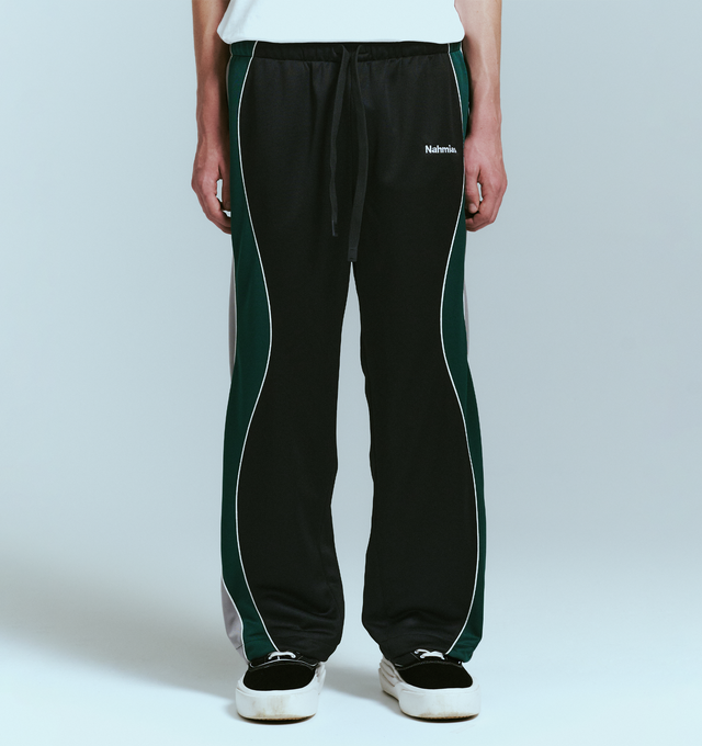 Image 2 of 4 - BLACK - NAHMIAS Ollie Track Pant featuring elastic waist with drawstring closure, 4-pocket styling, embroidered logo, relaxed fit and stripes and piping down leg. 100% polyester.  