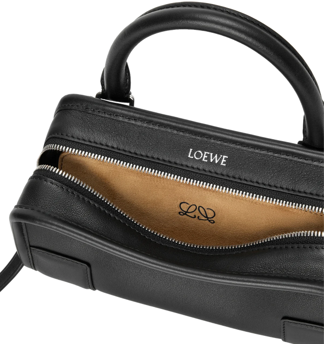 Image 7 of 11 - BLACK - LOEWE Mini Amazona 180 Bag in soft calfskin featuring two carry options: short handle, removable and adjustable crossbody strap, zip closure with two leather zip pullers, two compartments, main compartment closed with magnetic closure, left side d-ring for customization, suede lining, embossed LOEWE and embossed double L branding. Soft calfskin. 11.5 cm x 20 cm x 7 cm. Made in Spain. 