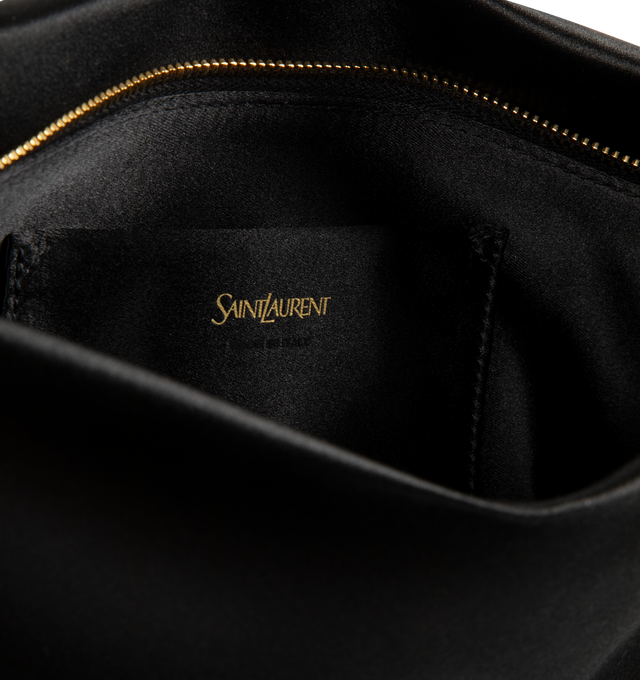 Image 3 of 3 - BLACK - SAINT LAURENT Folded Evening Clutch featuring soft pouch in satin, hammered logo charm, lightweight clutch, certified viscose and certified silk lining, bronze-tone hardware, zip closure and one flat pocket. 11.6" x 5.5" x 1.2". Viscose, silk. Made in Italy. 