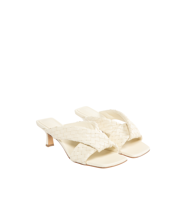 Image 2 of 4 - WHITE - BOTTEGA VENETA Riva Mule featuring kitten heel mule sandal in woven lambskin with padded tubular straps, twisted design and rubber-injected leather outsole. Heel: 2". Lambskin. Made in Italy. 