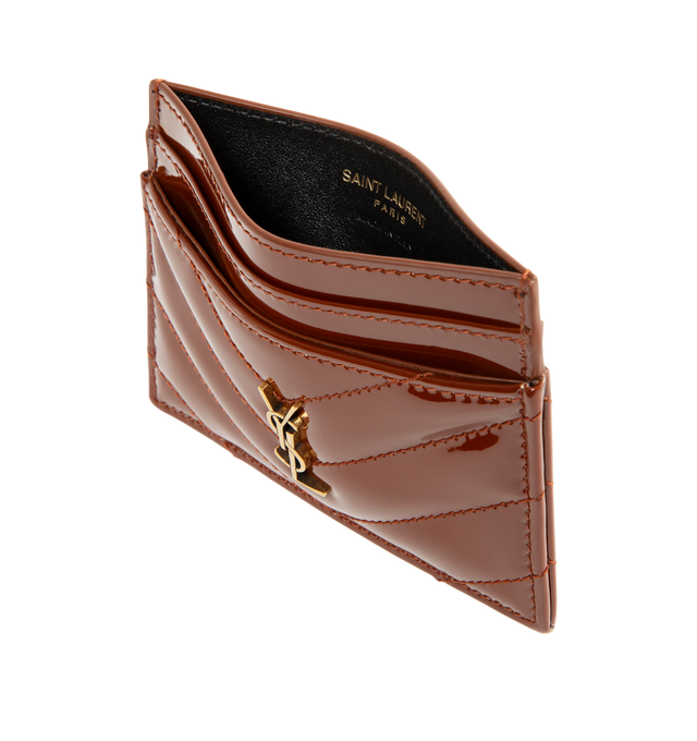 Image 3 of 3 - RED - Saint Laurent Women's Cassandre Card Case is crafted from glazed brown patent calfskin leather and features quilted topstitching, bronze-tone Cassandre hardware, and five card slots. Main Material: Calfskin Leather. Hardware: Brass. Dimensions: 10.5 x 7.5 x 0.5 cm / 4.1 x 3 x 0.2 in. Made in Italy. 