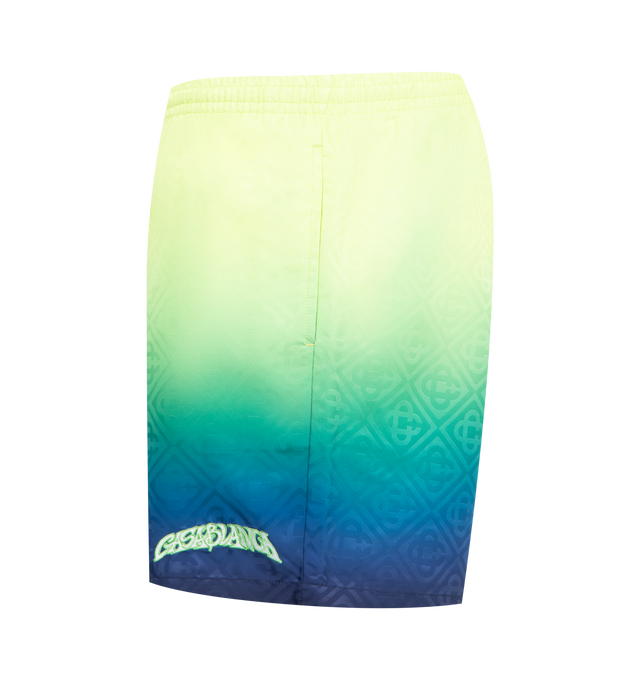 Image 3 of 3 - MULTI - CASABLANCA Gradient Monogram Swim Shorts featuring gradient detailing, an elasticised waistband, drawstring fastening, in-seam side pockets and the house's signature monogram pattern. Technical swim fabric. 100% polyester. Lining: 80% polyester 20% elastane. Made in Portugal. 