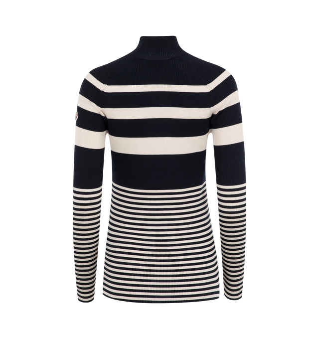 Image 2 of 2 - BLACK - Moncler Women's lightweight knit turtleneck sweater crafted from luxurious Merino wool featuring graphic black and white stripes and Moncler logo patch. 100% Virgin wool. 